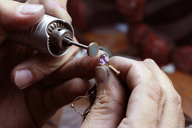 A jeweller sketching a custom ring design.